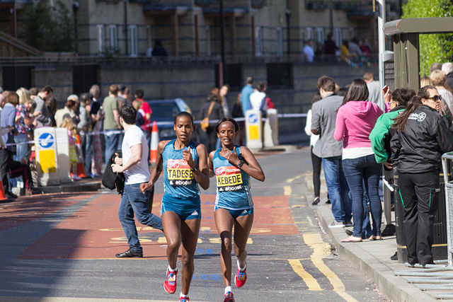 Two women running in marathon