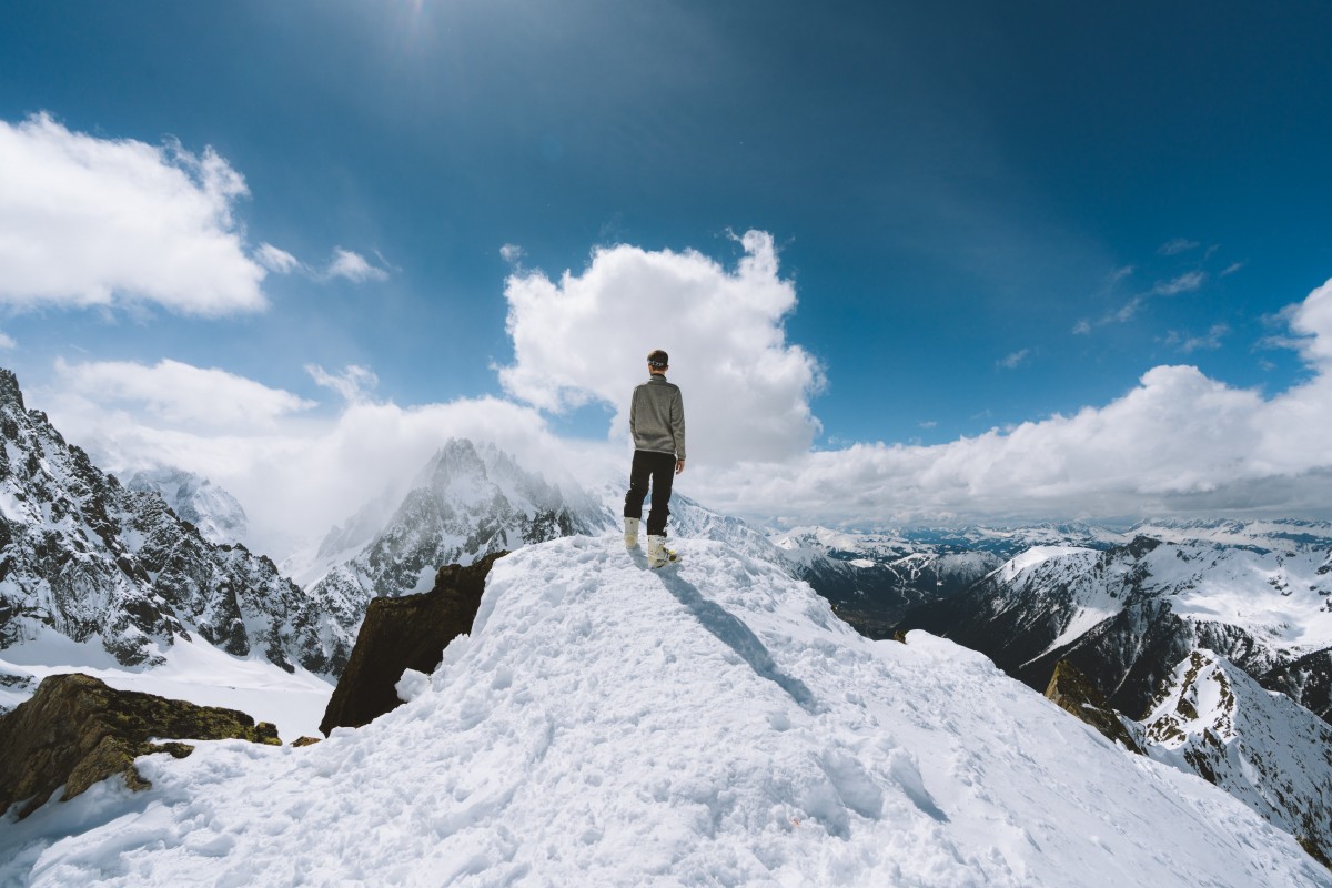 Person standing on mountain top