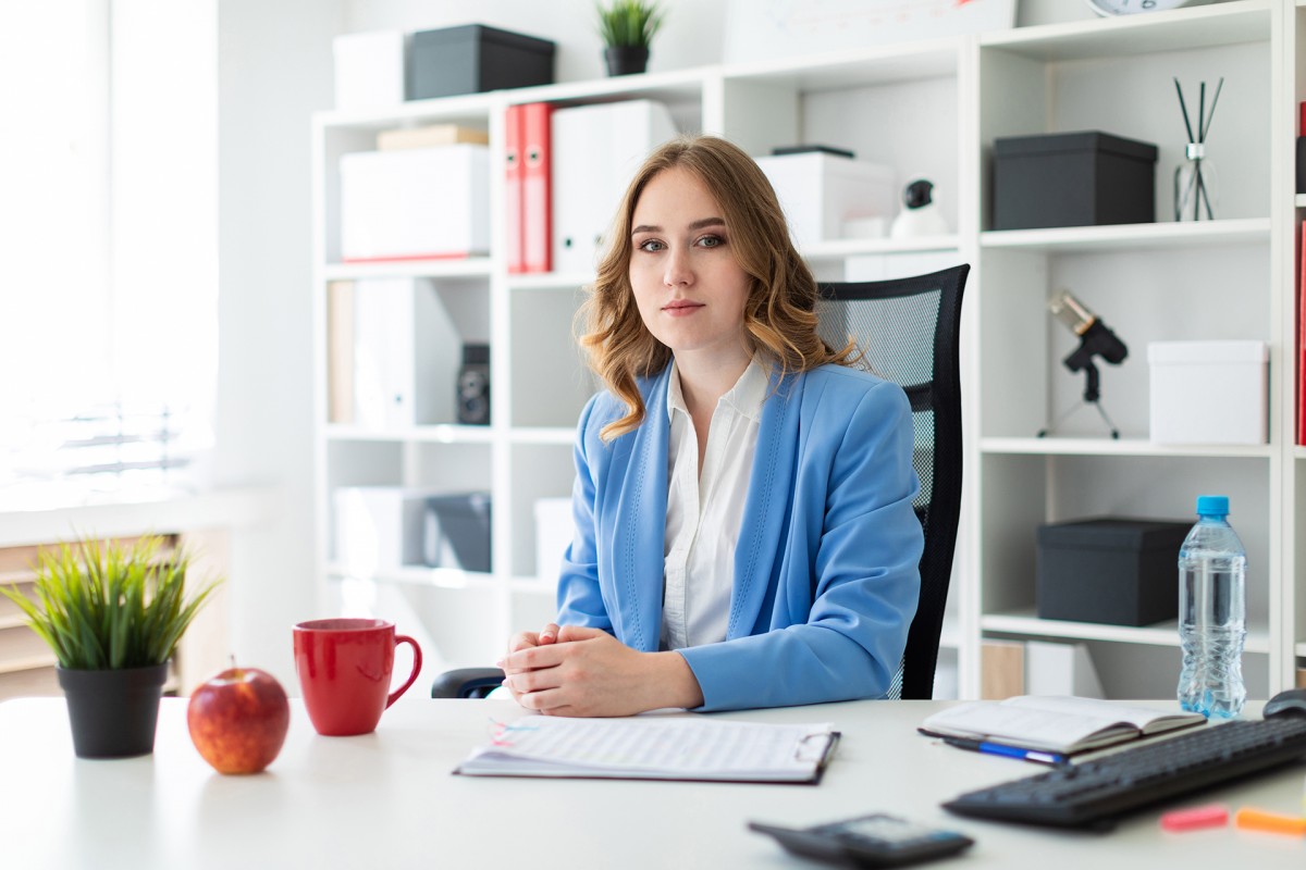Woman sitting at desk in office