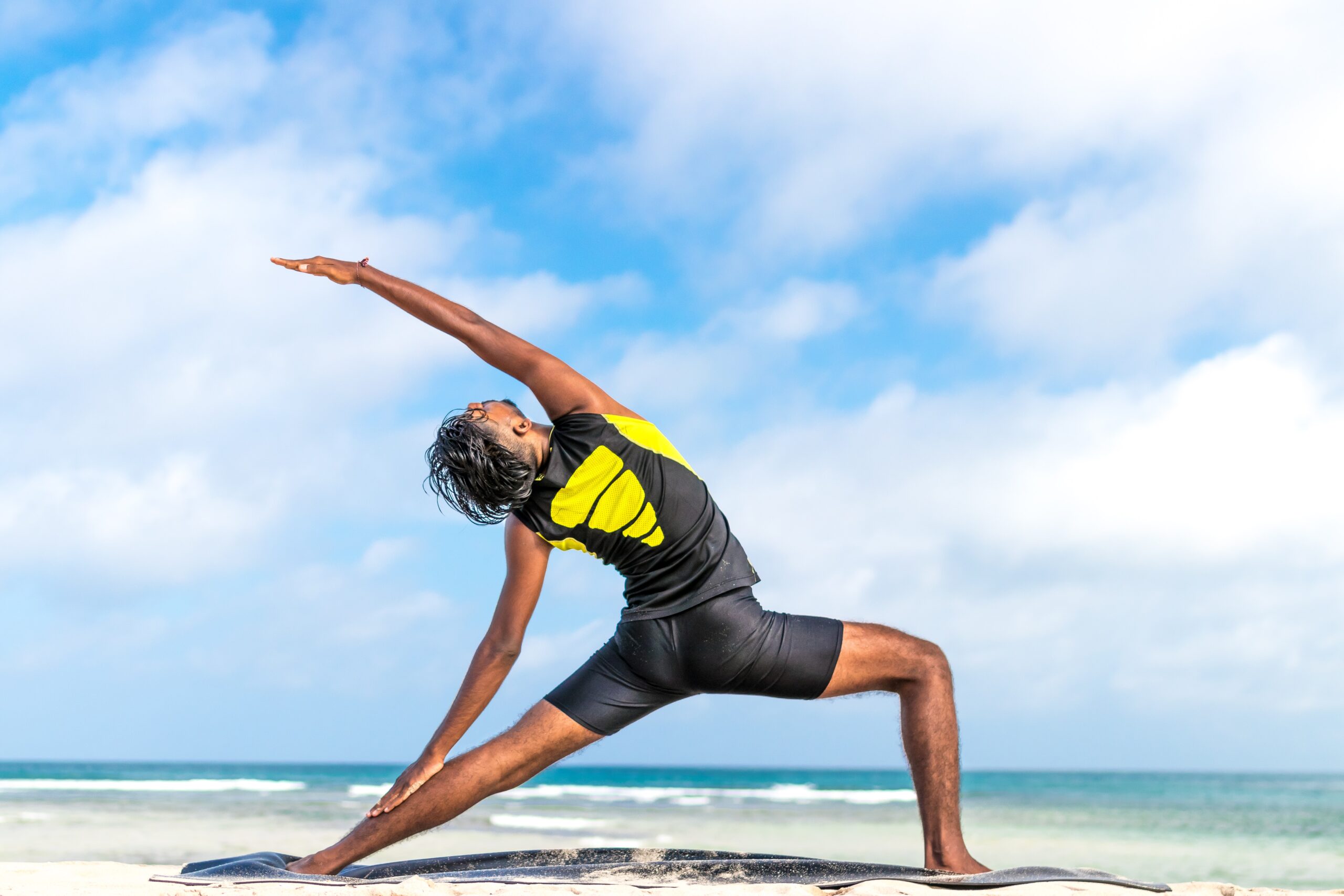 Person stretching on the beach