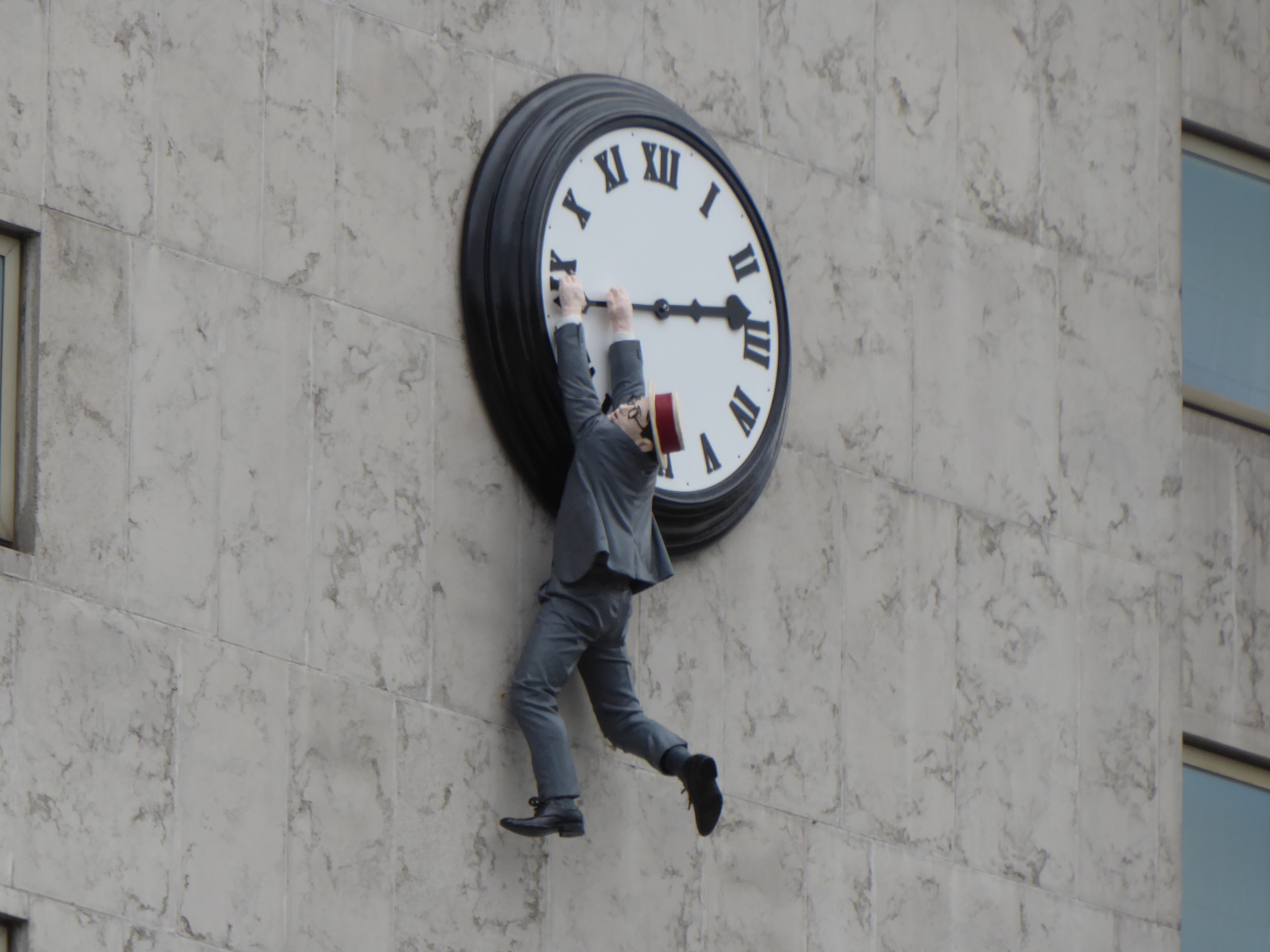Harold Lloyd's imitation hanging down the clock in the film Safety Last! on a side of the InterContinental Vienna hotel in November 2016.